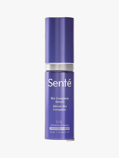 A blue bottle of Senté Bio Complete Serum on a light gray background